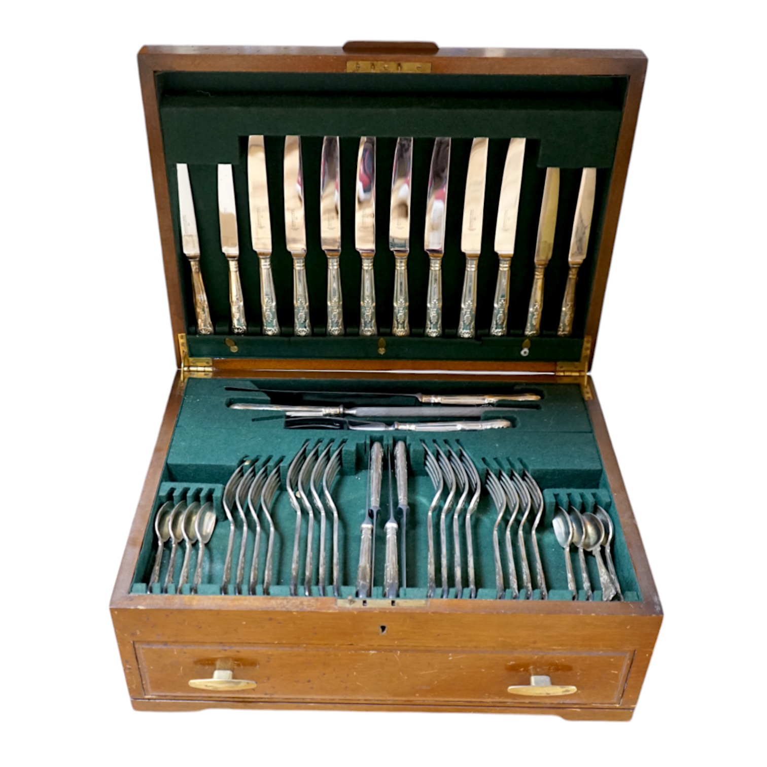 A walnut cased canteen of cutlery with drawer, retailed by Harrods. Condition - one dessert spoon missing